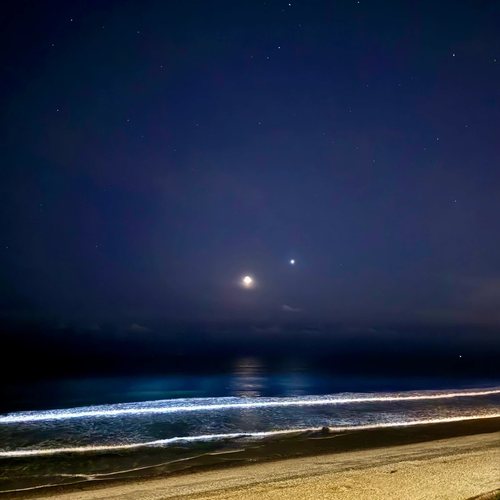 Ethereal album cover: a moonlit ocean and silver waves beneath a deep blue sky